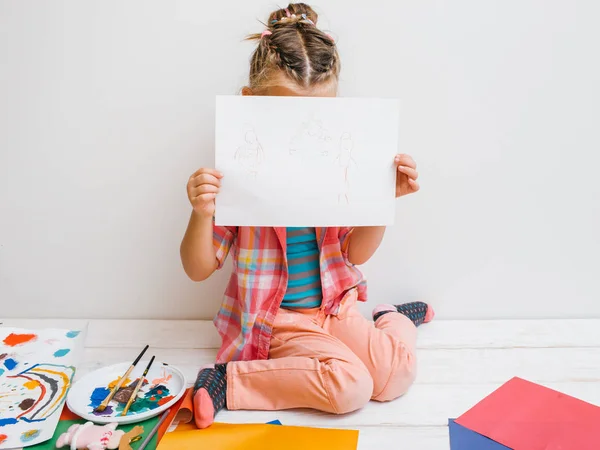 Uncertain artist. Shy baby girl — Stock Photo, Image