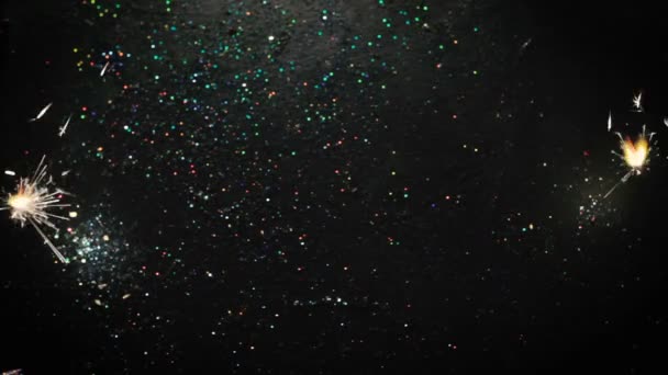 Firework sparkler lights on glittering background — Stock Video
