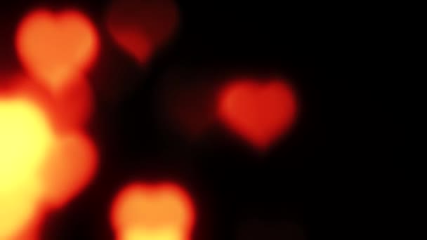 Red hearts background blur orange gleaming lights — Stock Video