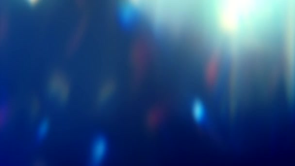 Resplandecientes luces de fondo azul llamaradas motas — Vídeo de stock