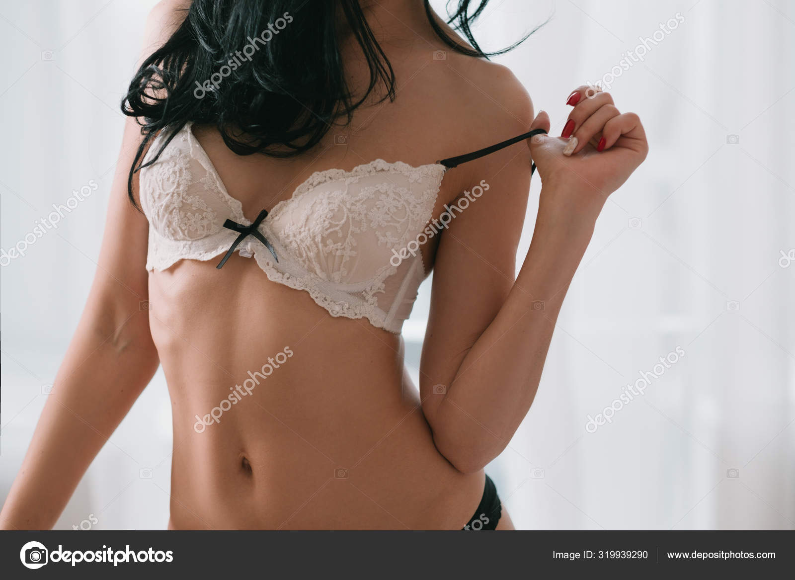Sensual flirt seduction woman taking off lace bra Stock Photo by ©golubovy 319939290