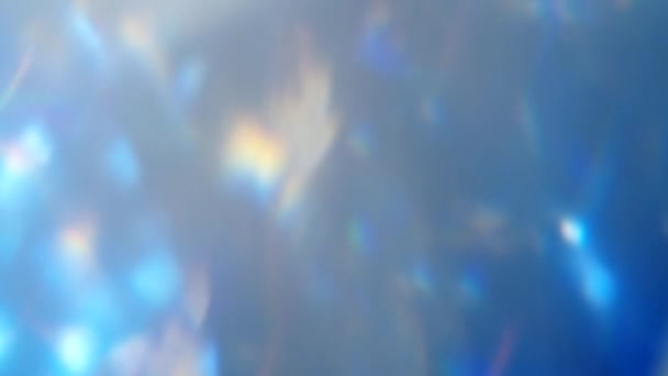 模糊的火花覆盖在发光斑上，移动着蓝色 — 图库视频影像