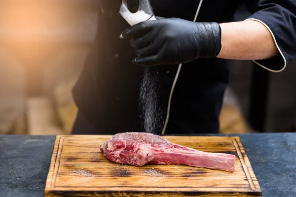 Steakhouse kitchen cowboy recipe steak salting beef meat — Stock Image Steakhouse kitchen cowboy recipe steak salting beef meat Stock Photo