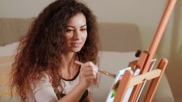 Art therapy inspired woman enjoying painting — Stock Video