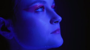 neon light portrait woman art glitter makeup blue