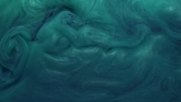 Swirling haze cloud glitter teal blue paint flow — Stock Video