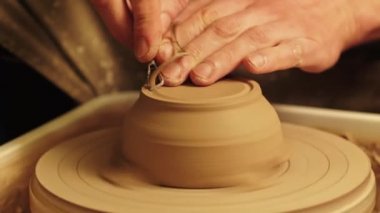 ceramics art man hands carving clay pot wheel