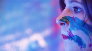 creative block pensive woman paint face skin