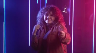 neon girl night party smiling woman dancing pink
