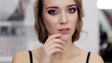 makeup art skin care woman touching face gently