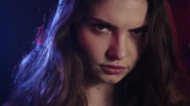 colored light portrait doubtful girl neon glow