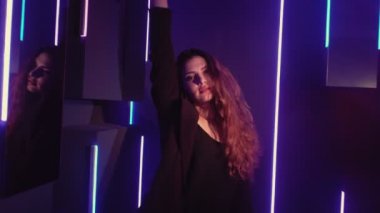 neon lights girl music festival woman dancing blue