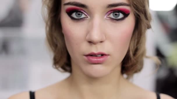 Decorative makeup woman touching glossy lips — Stockvideo