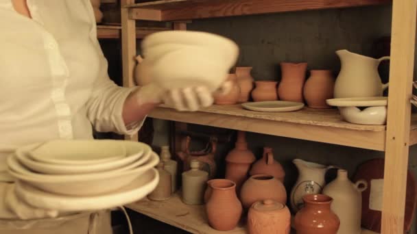 Pottery artist lifestyle woman clay plates stack — ストック動画