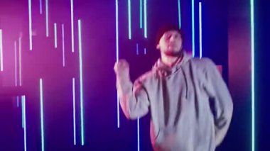 neon light dancer man hip hop style moves blue
