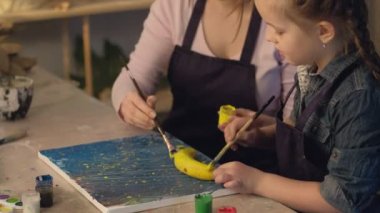 creative family mother daughter painting banana