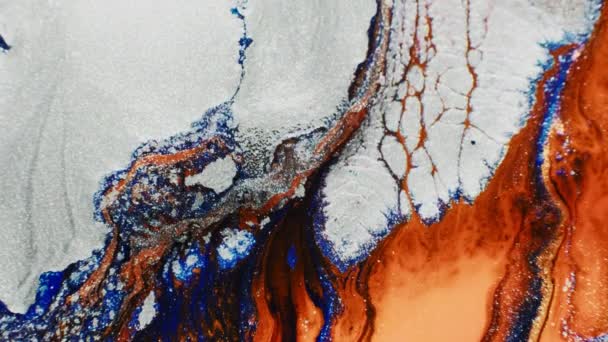 Flowing fluid glitter white orange paint motion — ストック動画