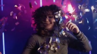 neon girl happy young woman enjoying confetti