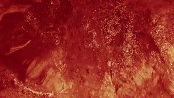 Рідка текстура фарби блиск червоного помаранчевого чорнила рух — стокове відео