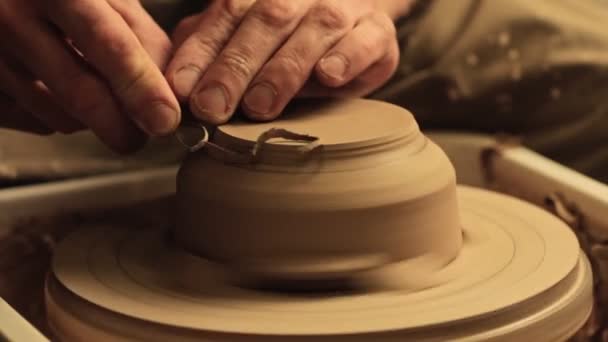 Pottery manufacturing artist hands carving clay — Stock Video