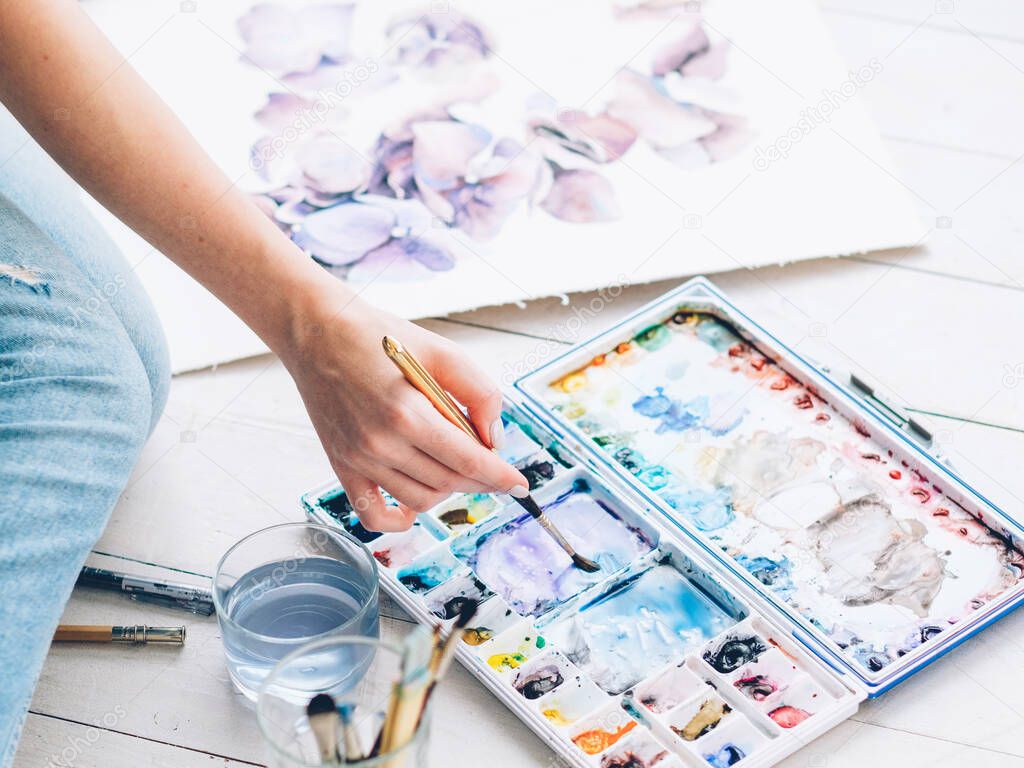 fine art hobby woman mixing watercolor paint