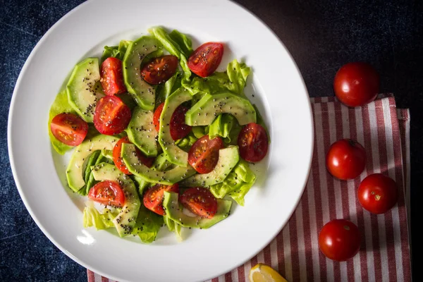 Avocado salad with cherry tomatoes and chia seeds — Stock Photo, Image