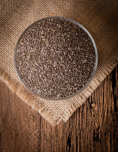 Chia seeds on wooden background. Top view — Stock Photo, Image