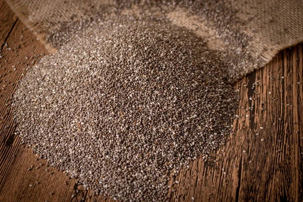 Chia seeds on wooden background — Stock Photo, Image