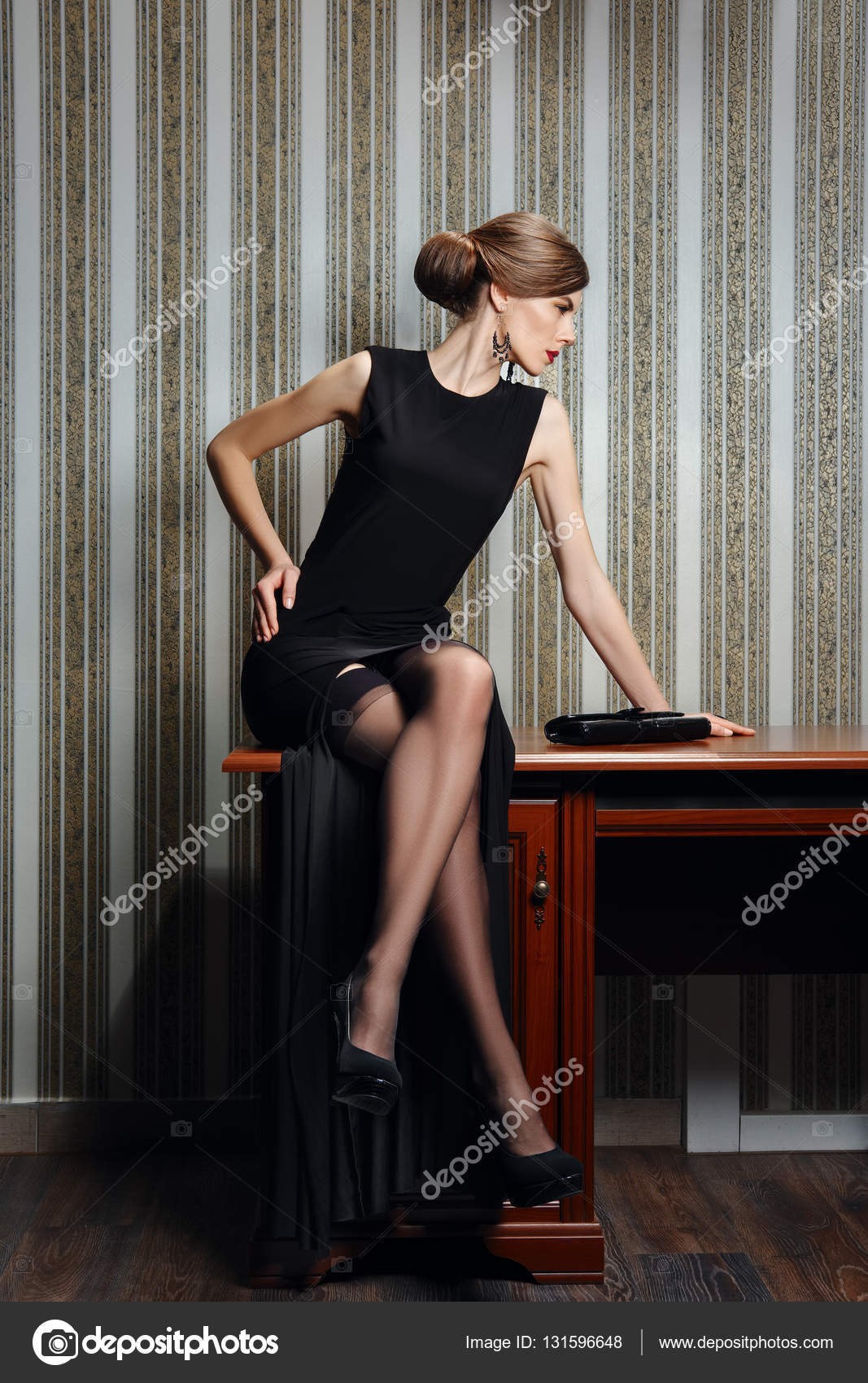 Gorgeous lady in elegant evening black dress with deep cut - stock photo  115331