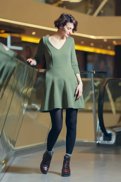 Happy smiling girl posing in green dress — Stock Photo, Image