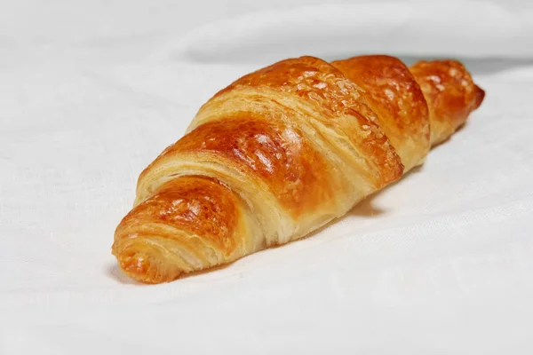 Fresh baked croissants on napkin — Stock Photo, Image