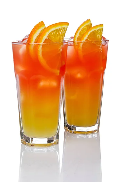 Two highball glasses with Juicy Orange and Red Tequila Sunrise c — Stock Photo, Image