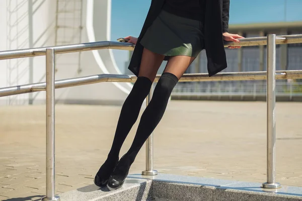 Long slim female legs in knee socks on top of tights and short l — Stock Photo, Image