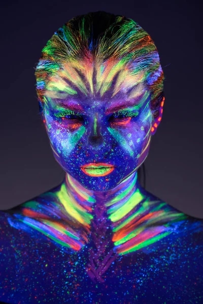 Portrait of beautiful girl with ultraviolet paint on her face. G — Stock Photo, Image