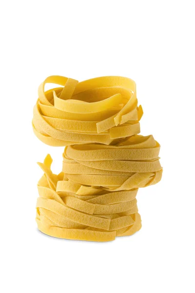 Nest noodles isolated on white background. Italian tagliatelle with egg. — 스톡 사진