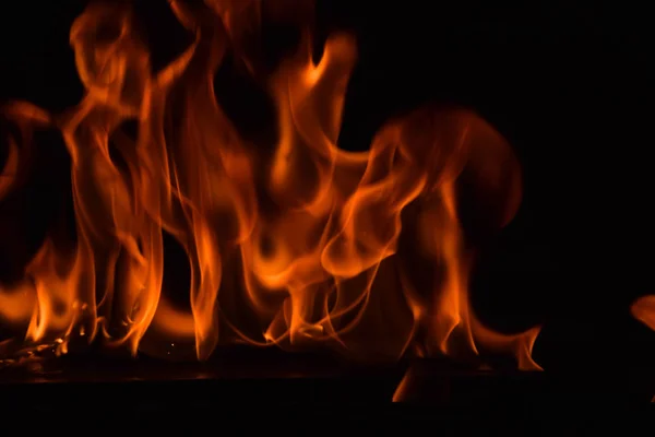 Beautiful fire flames on black background. — Stock Photo, Image