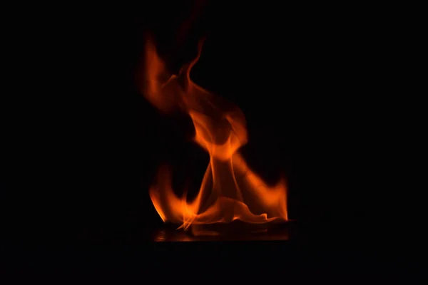 Beautiful fire flames on black background. — Stock Photo, Image