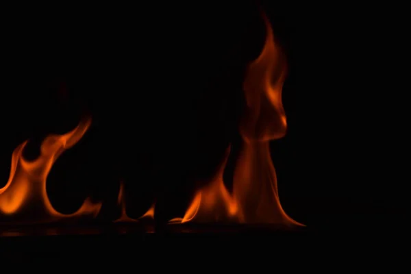 Beautiful fire flames on black background. — Stock Photo, Image