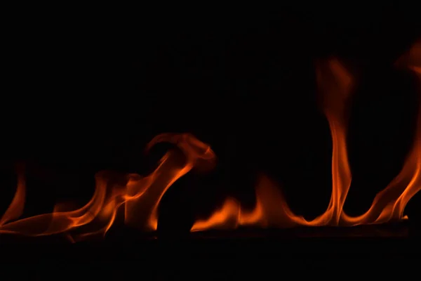 Beautiful fire flames on black background. — Stock Photo, Image