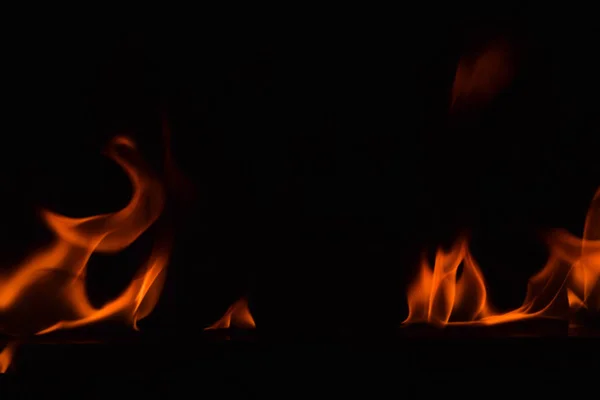 Beautiful fire flames on black background. — Stock Photo, Image