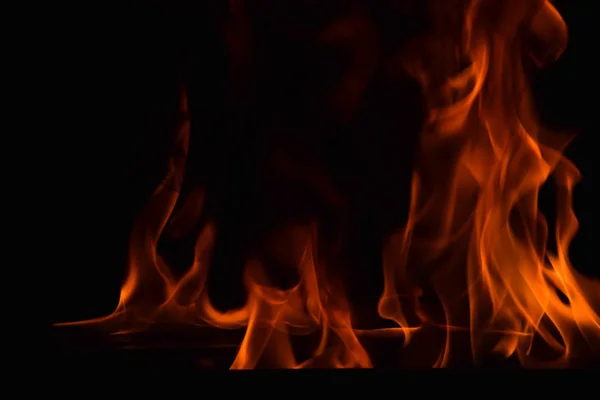 Beautiful fire flames on black background. — Stock Photo, Image