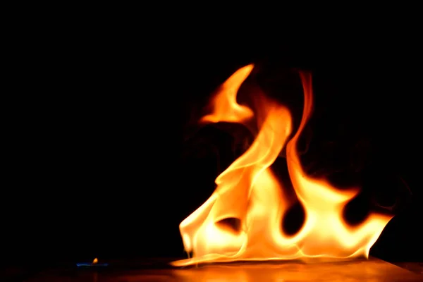 Beautiful fire flames on black background. — Stock Photo, Image