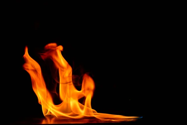 Beautiful fire flames on black background. — Stock Photo, Image