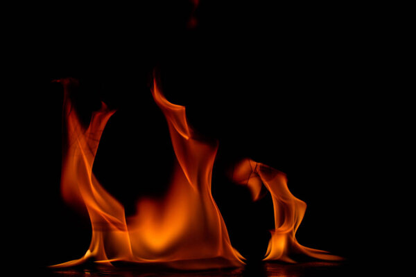 Beautiful fire flames on black background.