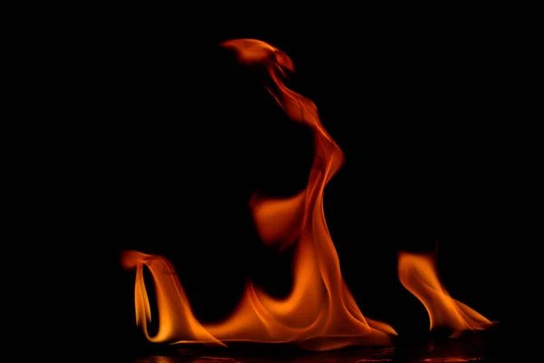 Beautiful fire flames on black background. — Stock Photo, Image