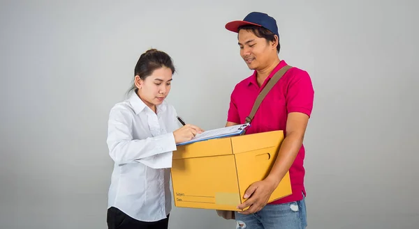 Asian Women are signed Document to receive items from the cargo staff After buying new home and moving home in delivery service concept