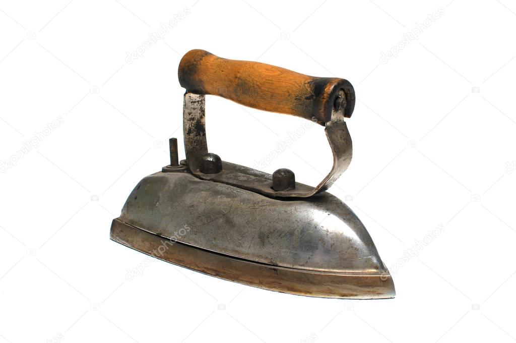 Old iron iron with wooden handle on a white background.Isolated picture.To iron.