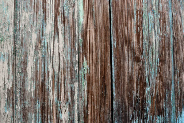 Antiguo fondo de madera maltrecho con grietas y capas de pintura — Foto de Stock