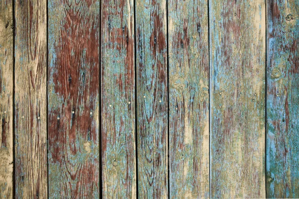 Velho fundo de madeira gasto com rachaduras e camadas de tinta — Fotografia de Stock