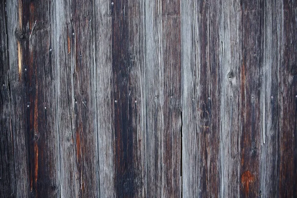 Trä bakgrund. Gamla och bleknat remsor av grå och brun färg med träfibrerna — Stockfoto